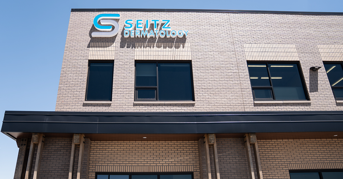 A sign that says "Seitz Dermatology" on a building